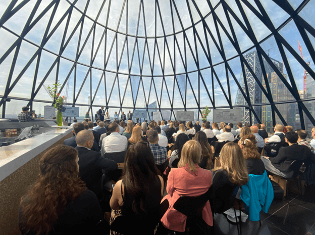 Audience sat in the Gherkin watching panelists talk at the Industry Insight event