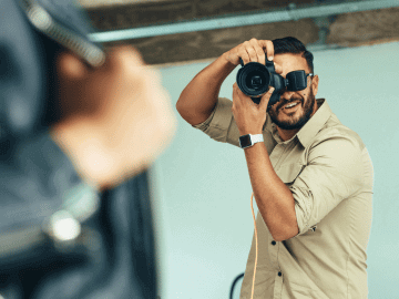 Male photographer shooting in an indoor studio