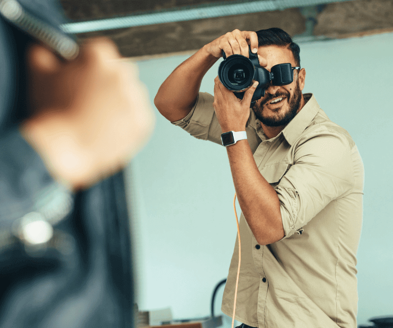 Male photographer shooting in an indoor studio